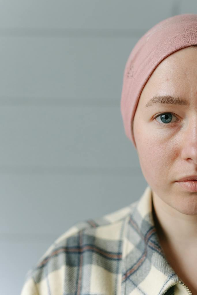 Half Face of a Woman Wearing Pink Bonnet